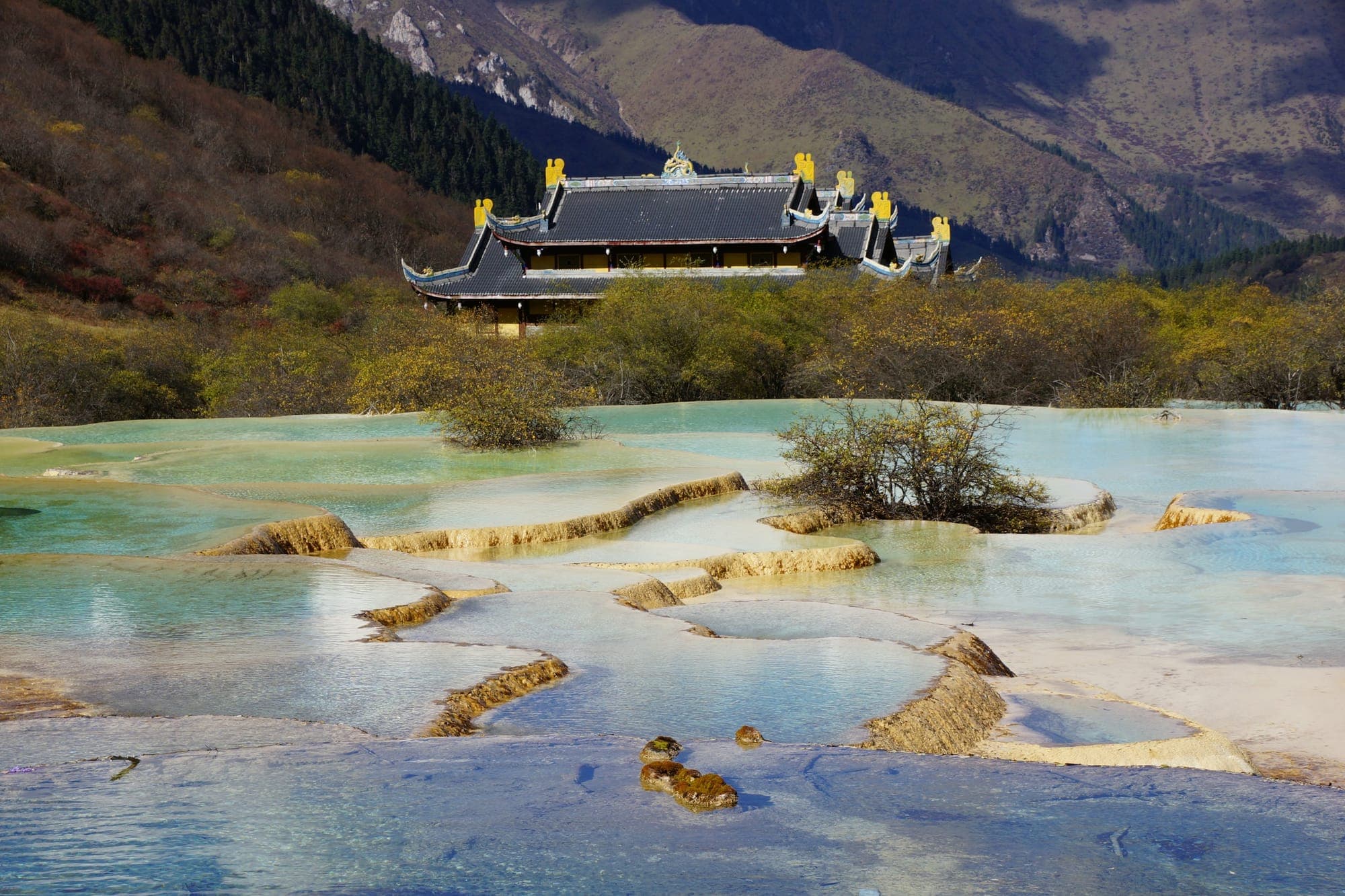 Huanglong Temple above the terraced travertine pools of Huanglong, Sichuan
