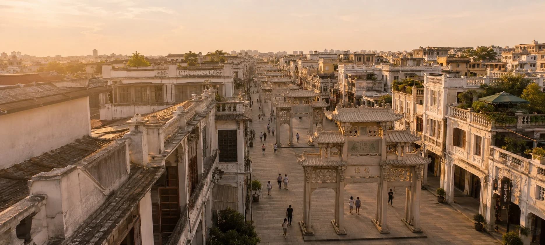 Chaozhou Paifang Street: stone memorial arches and shophouse arcades at golden hour