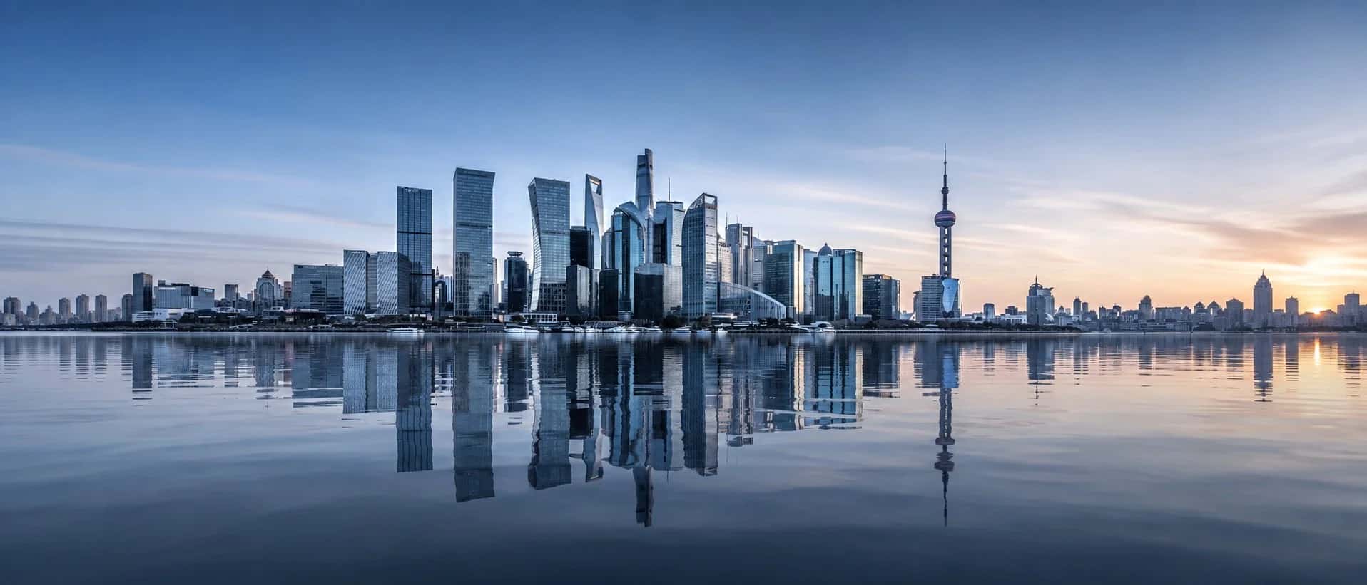 Shanghai skyline across the river at dusk